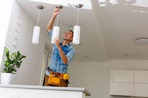 Electrician Fixing Light