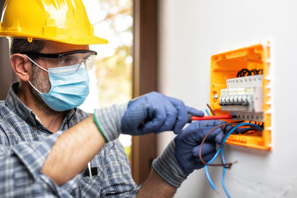 at work on an electrical panel